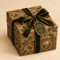 Elegant mystery gift box with vintage vines and leaves pattern in earthy browns and greens on a creamy beige background